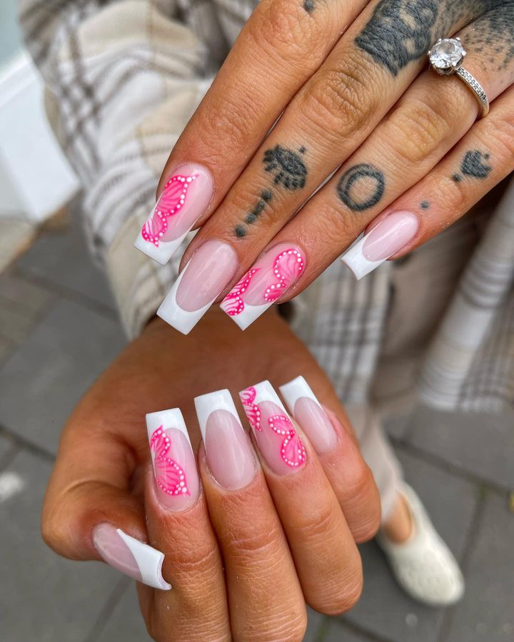 White French tip acrylic nails with pink marble nail art